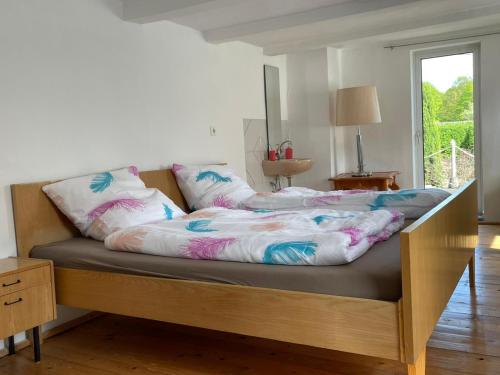 a bed with two pillows on it in a bedroom at Sauerland-Relax in Schmallenberg