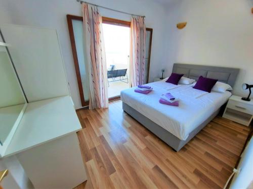 Postel nebo postele na pokoji v ubytování Belleview Apartments Vrbica