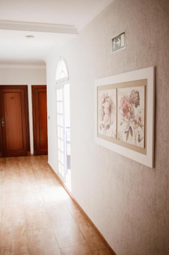 a room with a picture on a wall with aoice at Hostal la Campana in Motril
