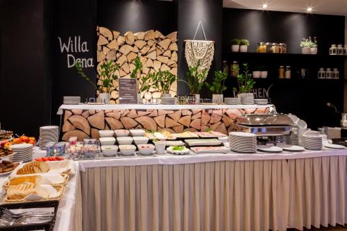 a table topped with lots of different types of food at Willa Dana in Wisła