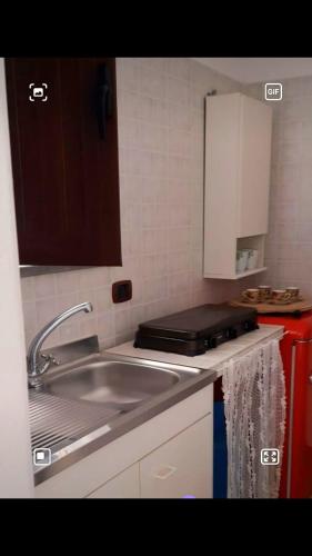 a kitchen with a sink and a counter top at A casa dell’amica mia in San Nicola Arcella