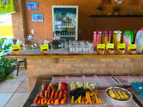 a buffet of fruits and vegetables on a table at Hotel Pousada Beleza das Ondas in Cumbuco