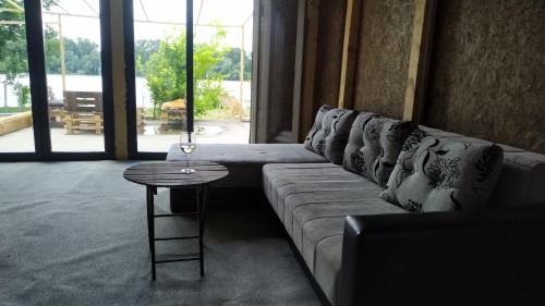 a living room with a couch and a table at Top Chill party kucice apartmani in Belgrade