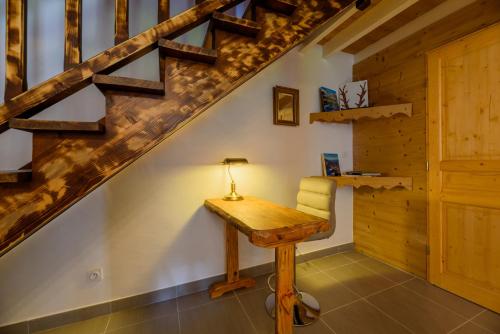 a desk in a room with a staircase at St Lary/Vignec: Les 3 Flocons in Vignec