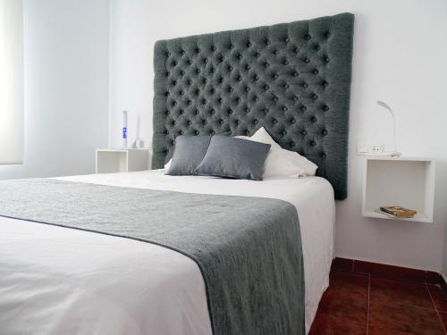 Posteľ alebo postele v izbe v ubytovaní Samadhi Home