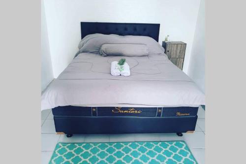 Кровать или кровати в номере Stay@Pitaloka