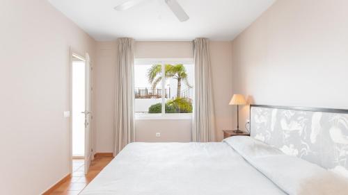 Кровать или кровати в номере Real Agua Amarga Las Villas