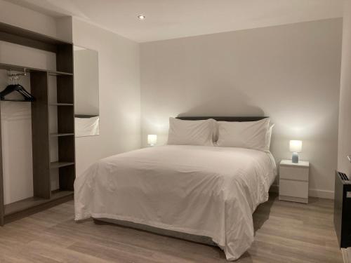 Llit o llits en una habitació de Coastal Plaza