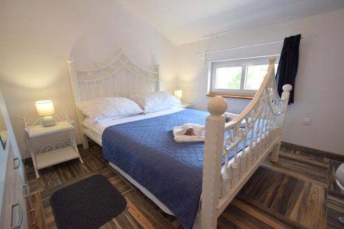 Ένα ή περισσότερα κρεβάτια σε δωμάτιο στο Apartments Dunja