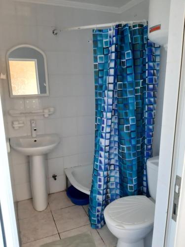 a bathroom with a toilet and a sink at Зюйд in Gribovka