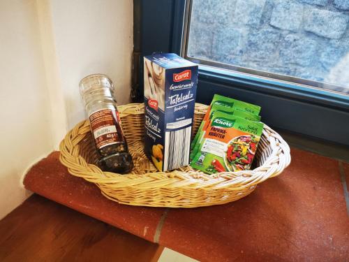 a basket with food and drinks on a table at Ferienapartment Opitz - Zugspitzregion in Ohlstadt