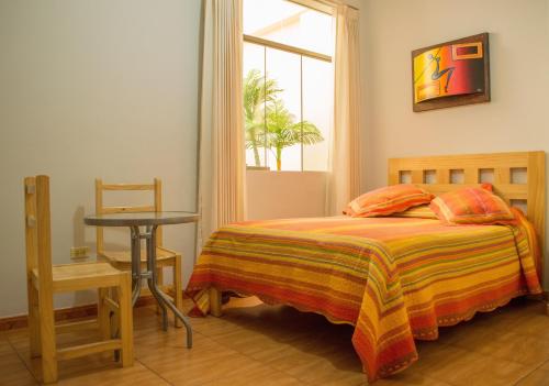 Llit o llits en una habitació de Takora Inn