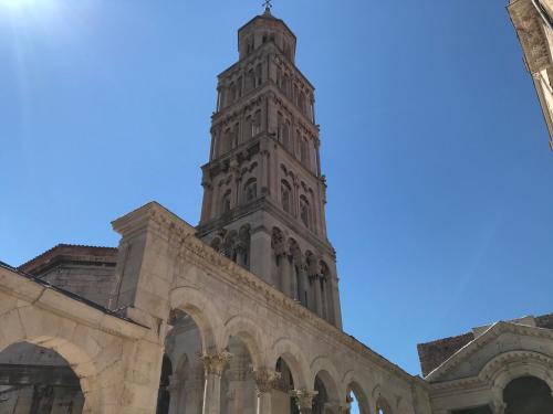 a tall clock tower on top of a building at Central Park Residence in Split