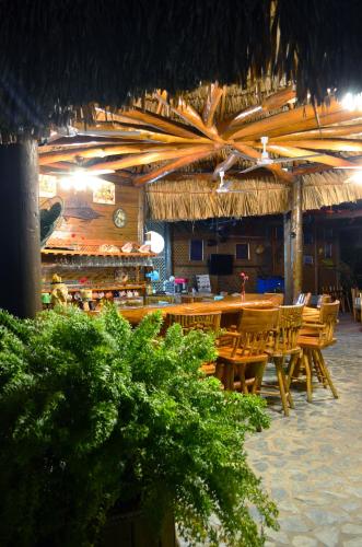 a restaurant with a bunch of tables and chairs at Mar Marine Yacht Club in Rio Dulce