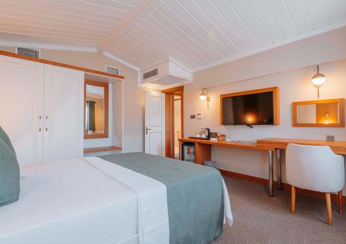 Ένα ή περισσότερα κρεβάτια σε δωμάτιο στο TS Park Hotel