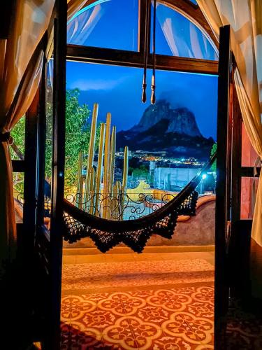 an open door with a view of a mountain at Hotel Boutique Santo Cuervo in Bernal