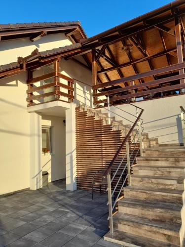 a set of stairs in a house with a wooden roof at Vila Miorita in Sebeş