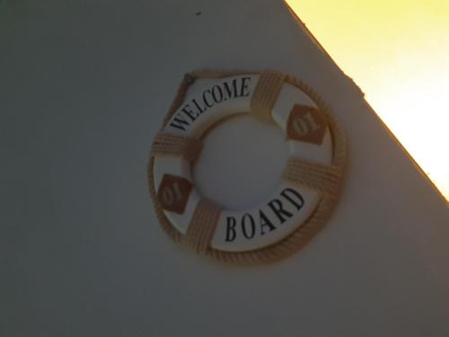 a close up of a toilet bowl with the words welcome boobs at Sunset Villa in Nea Paphos