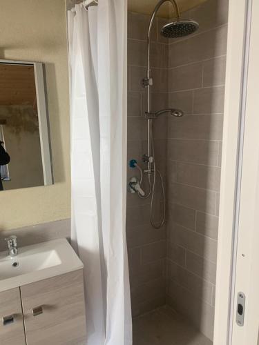 a bathroom with a shower with a shower curtain at La casina in Sonnino