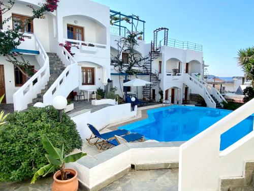 a villa with a swimming pool and stairs at Egli in Stalos