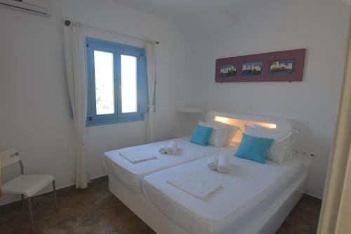 Ένα ή περισσότερα κρεβάτια σε δωμάτιο στο ThalaSEA - village Antiparos