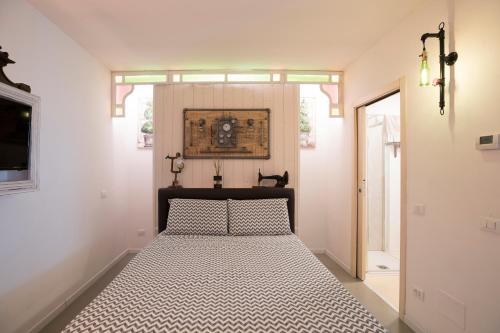 a bedroom with a bed in a room with a window at Come sentirsi a casa in Piacenza