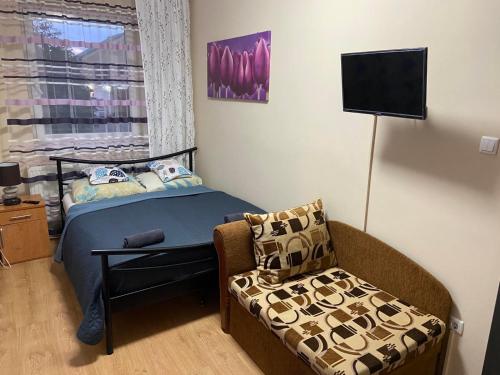 Postel nebo postele na pokoji v ubytování Melinda Apartman