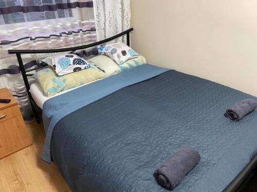 Postel nebo postele na pokoji v ubytování Melinda Apartman