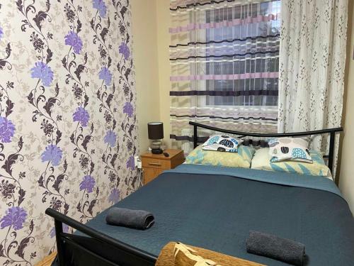 Postel nebo postele na pokoji v ubytování Melinda Apartman