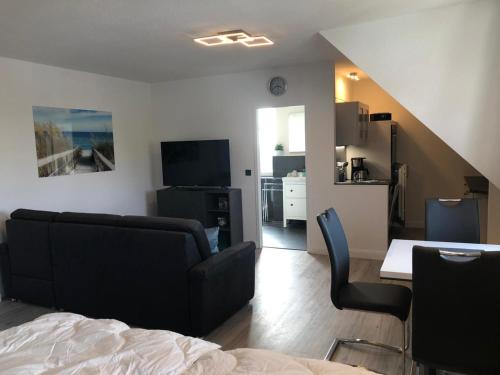 Un televizor și/sau centru de divertisment la Studio-Apartment Ankerplatz im Ferien-Resort Rügen