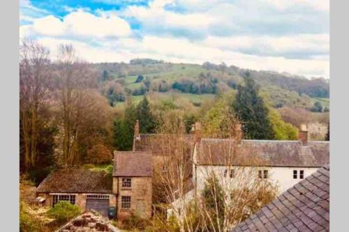 a group of houses in a field with trees at The Tenth House, Grade II Listed Georgian Town House, Wirksworth, Derbyshire, Peak District Cottage, Sleeps 4 in Wirksworth