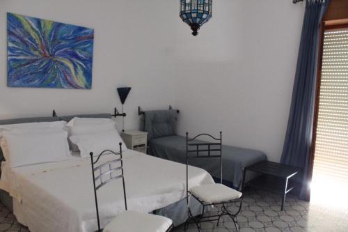 Postel nebo postele na pokoji v ubytování Villa Pedaci B&B