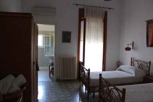 Postel nebo postele na pokoji v ubytování Villa Pedaci B&B