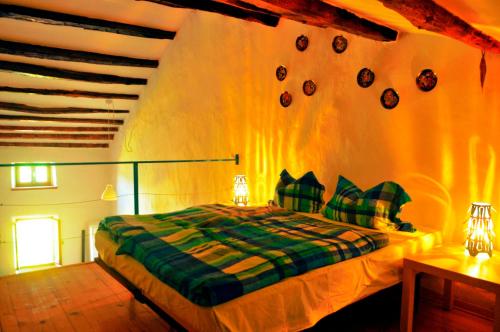 a bedroom with a bed in a room with lights at Ruine-Motovun DH in Motovun