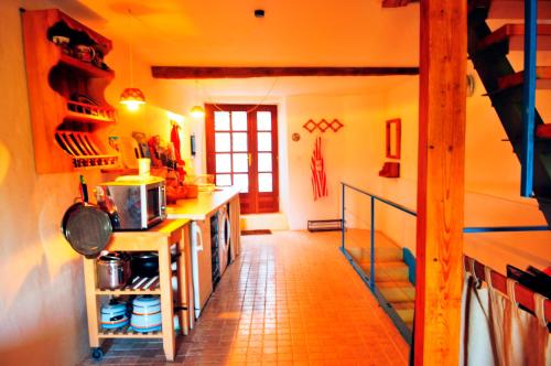a kitchen with a counter and a staircase in a room at Ruine-Motovun DH in Motovun