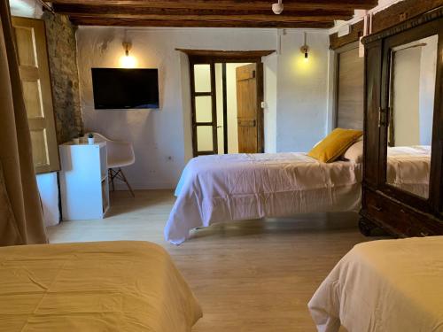 Ένα ή περισσότερα κρεβάτια σε δωμάτιο στο Maison del Arc