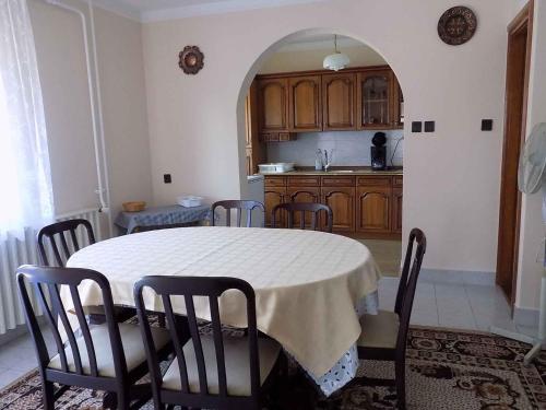 a kitchen with a table and chairs in a room at Apartment Gyenesdias 3 in Gyenesdiás