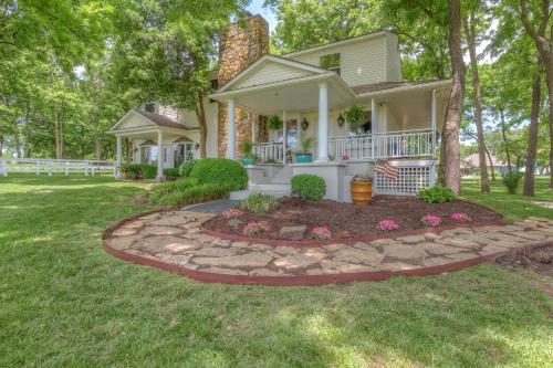 a house with a stone walkway in the front yard at The Funky Monkey Inn in Afton