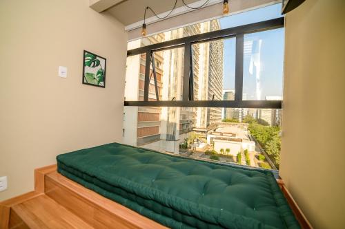 Cama o camas de una habitación en Ape Paulista Augusta