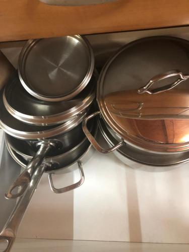 a frying pan and utensils sitting on top of a stove at Lemnoshouse in Mirina