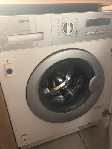 a white washing machine with a bowl in it at Lemnoshouse in Mirina