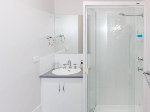 a bathroom with a sink and a shower at 20 Lady Bay Road in Normanville