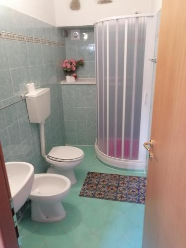 a bathroom with two toilets and a shower at I Limoni 2 in La Spezia
