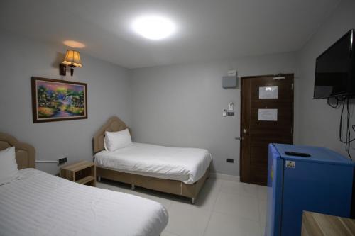 Postel nebo postele na pokoji v ubytování Kun Hotel