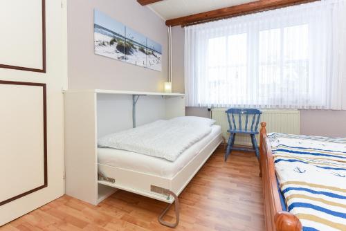 Postel nebo postele na pokoji v ubytování Ferienwohnung Deichtor im Haus am Deichtor