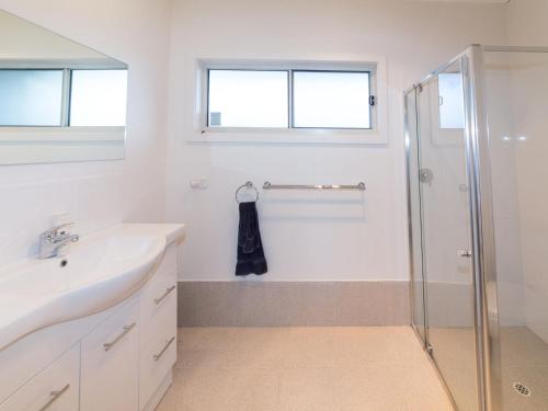 a bathroom with a sink and a shower at Fleurieu Coastal Retreat Lot 150 Myponga Beach in Wattle Flat