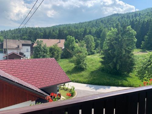 a view from a balcony of a house with a mountain at Žigon Bed & Breakfast in Logatec