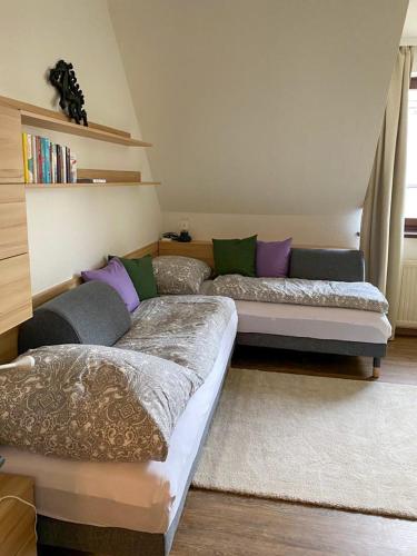 a living room with two beds and a couch at Kirchengasse 162 - Alte Post II in Bad Aussee