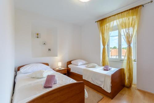 Postel nebo postele na pokoji v ubytování Apartman Mare