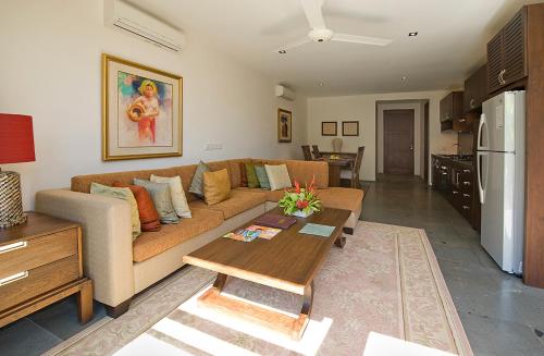 a living room with a couch and a table at Gending Kedis Luxury Villas & Spa Estate in Jimbaran